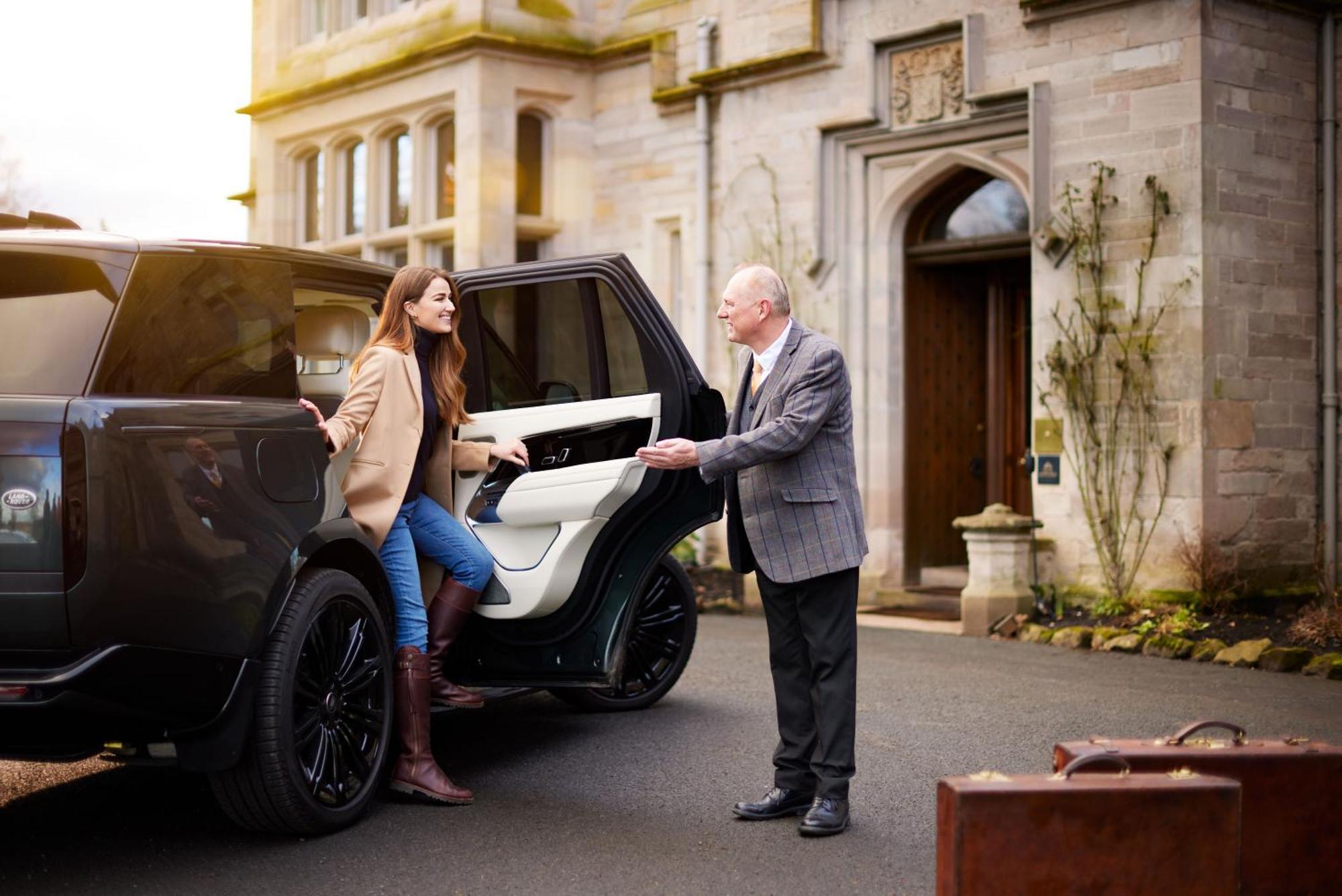 Schloss Roxburghe, Part Of Destination By Hyatt Dış mekan fotoğraf A chauffeur opening the car door for a passenger